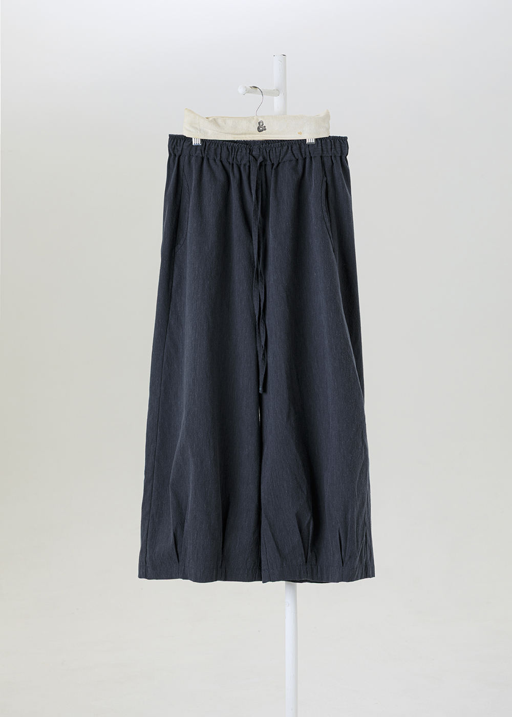 謐境下擺打褶繭型褲 