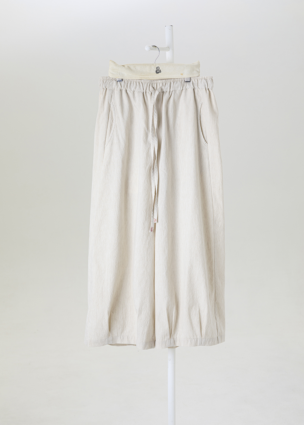 謐境下擺打褶繭型褲 