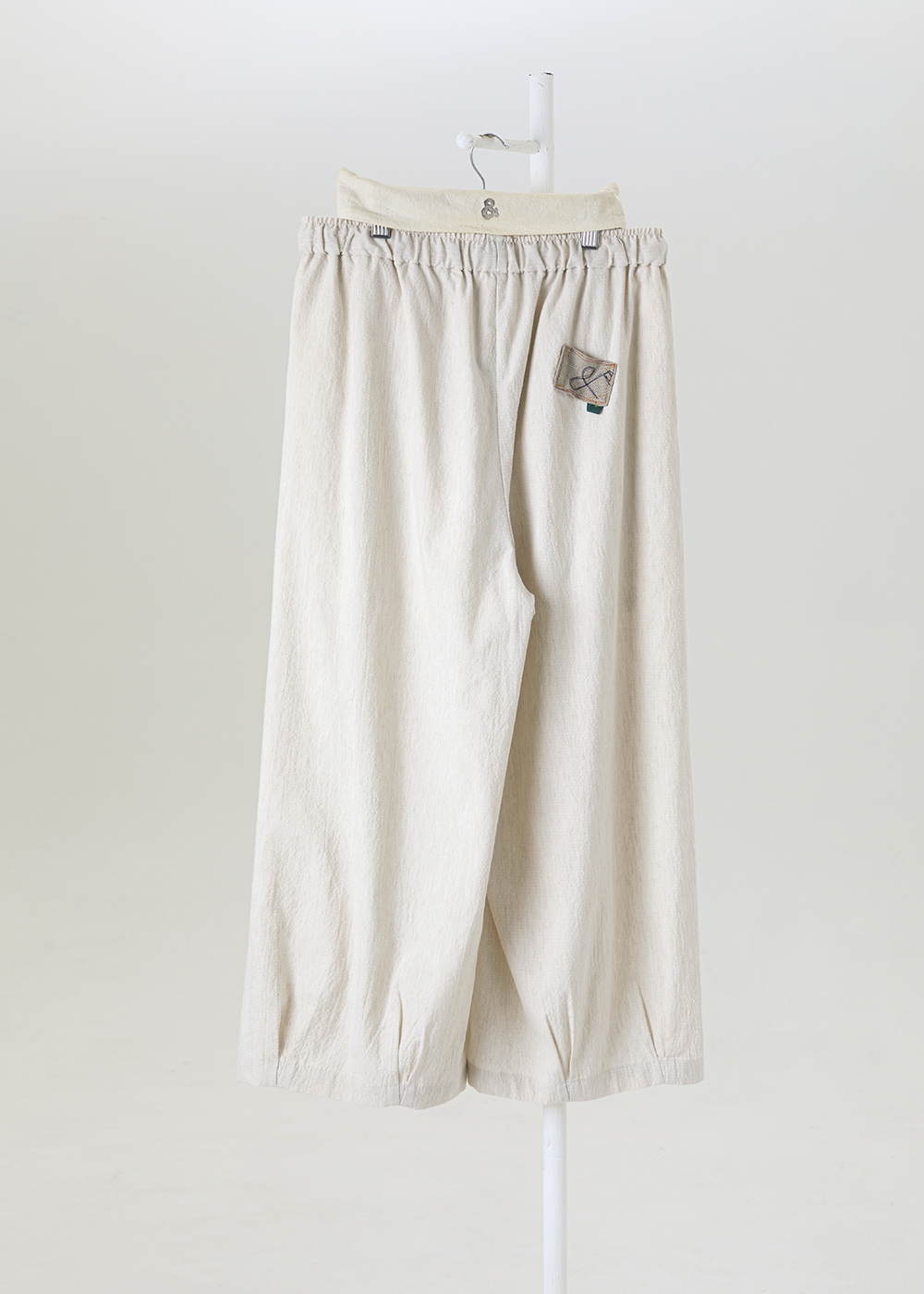 謐境下擺打褶繭型褲 